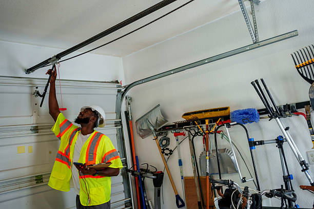 Professional Garage Door Maintenance technician working in Laurel, MS